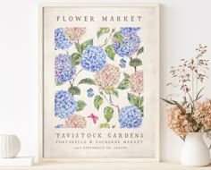 a flower market poster with blue and pink flowers