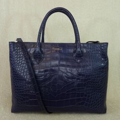 Classic Martha Tote By Furla. Made Of Dark Blue With Purple Hue Croc Embossed Genuine Distressed Leather Dimensions: 14" Wide Across X 10.5" Tall Center X 4" Deep. Double Handle 5" Drop. You Can Only Carry It Over The Shoulder If You Have Small Arms. Comes With Long Detachable Shoulder Strap Center Zipper Bonus Compartment 1 Slip Pockets And 1 Zipper Pocket Furla Logo Fabric Lining. Silver Tone Metalware. Comes Complete With A Dust Bag And Care Card. Blue Leather Bag, Beige Tote Bag, Beige Tote, Furla Bags, Small Arms, Dark Ink, Blue Tote Bag, White Tote Bag, Suede Handbags