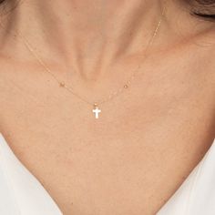 ★ Embrace Contemporary Faith with the 14K Gold Cross Necklace Discover a fresh take on spiritual expression with our Cross Necklace, a modern twist on traditional faith-based jewelry. Crafted with devotion in sumptuous 14K gold, this piece from MyJewelist represents the cross in a unique, horizontal display, signifying a path of faith that walks beside you. Why Our Cross Necklace? ★ A New Direction of Faith: The side-positioned cross is a symbol of the modern Christian's journey - innovative, contemporary, and walking in faith alongside you through every moment of life. ★ Subtle Elegance: With its sleek design, this necklace offers a delicate statement of belief that pairs seamlessly with any outfit, making it a versatile addition to your daily wardrobe or for special occasions. ★ Gold Tha 14k Gold Spiritual Cross Necklace, White Spiritual Cross Pendant Jewelry, Spiritual White Cross Jewelry, White 14k Gold Cross Necklace Gift, White 14k Gold Cross Necklace As Gift, 14k Gold White Cross Necklace As Gift, White 14k Gold Cross Jewelry, 14k Gold Cross Jewelry In White, White Minimalist Cross Jewelry