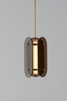 a modern light fixture hanging from a ceiling