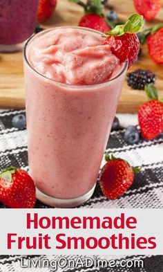 homemade fruit smoothie with strawberries on the side