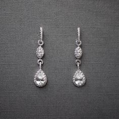 A timelessly chic design, featuring a cascading pair of pave-set teardrop and marquise stones. Offering a delicate, 1.5-inch length, these hypoallergenic earrings are plated with rhodium and exquisitely adorned with AAA CZ stones, free from lead, nickel, and cadmium. Luxury Nickel-free Dangle Earrings, Luxury Silver Earrings From Macy's, Luxury Elegant Nickel-free Earrings, Luxury Timeless Sterling Silver Bridal Earrings, Luxury Nickel-free Silver Earrings, Luxury Nickel-free Drop Earrings, Macy's Luxury Silver Earrings, Luxury Elegant Bridal Earrings With Pave Setting, Luxury Romantic Sterling Silver Earrings