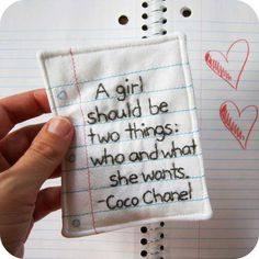 someone is holding up a piece of fabric with writing on it that says, a girl should be two things who and what she wants coco chose