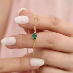 Adorn your wrist with timeless elegance with our 14K solid gold emerald oval bracelet, a true masterpiece celebrating the May birthstone. Meticulously handcrafted, this bracelet features a stunning oval emerald gemstone, known for its vibrant green hue and symbolization of rebirth and love. Perfectly set in luxurious 14K solid gold, this bracelet not only epitomizes sophistication but also ensures lasting beauty and durability. The bracelet designed to gracefully encircle your wrist while accent Oval Emerald Bracelets For Anniversary, Emerald Cut Emerald Bracelet As A Gift, Emerald Bracelets For Anniversary, May Birthstone, Formal Oval Bracelets With Birthstone, Oval Bracelet, Emerald Bracelet, May Birthstone, Emerald Necklace, Emerald Gemstone