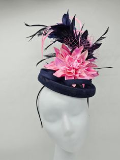 "Elegant large 18\" Navy blue and pink hat accented with different shades of pink feathers. Mounted on a 2\" headband for a secured look. Style to go with a variety of outfits: bridesmaids,  cocktail party,  Kentucky Derby, Rehearsal dinner, Easter and church outfits.  Ones with hair clip and headband. Are you trying to match an outfit? Send a picture and I will help you find a best hat to match your outfit.  - Rare find - Ready to ship  - Lightweight - Free Shipping - Fast shipping - Customize by adding different color flowers and or feathers Check my store for for styles and colors.  Hatsandpearls.etsy.com Find more at my website: www.hatsandpearls.com Reach out to me if you can't find what you are looking for.  I can make cake custom orders and help you style and match your outfit  Than Pink Feathered Fascinator With Curved Brim, Pink Feather Trim Mini Hat For Evening, Pink Mini Hat With Feather Trim For Evening, Fitted Pink Fascinator With Feather Trim, Fitted Pink Mini Hat With Feather Trim, Pink Feathered Evening Hat, Pink Feather Trim Fascinator For Royal Ascot, Pink Wedding Costume Hat With Feather Trim, Pink Feather Trim Wedding Hat