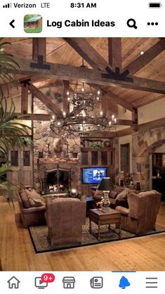 a living room filled with lots of furniture and a chandelier hanging from the ceiling