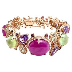 Bochic "Capri” Ruby, Sapphire, Amethyst & Aquamarine Bracelet Set 18K & Silver Ruby - 21 Carats Green Peridot - 6 Carats White Topaz - 4 Carats Sapphires - 2 Carats Purple Amethyst -6 Carats The Bochic "Capri" Opal & Multi Fancy Gems Bracelet is Set in 18K Gold & Silver is a stunning piece of jewelry designed for versatility and elegance. It features natural gems cabochons and brilliant cuts , showcasing pink, blue, and cream tones. The Bracelet also includes natural multi-color fancy Gems. Crafted in 18K gold and 950 silver, this Bracelet is a combination of luxury and craftsmanship, It is ideal for transitioning from day to night, making it suitable for swimwear, caftans, or evening wear. The "Capri" collection by Bochic is part of their traveling collection and showcases 18K gold and si Art Deco Drop Earrings, Elephant Bangle, Pearl Earring Set, Peridot Bracelet, Tree Jewelry, Aquamarine Bracelet, Modern Bracelets, Peridot Earrings, Gems Bracelet