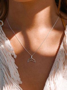 Looking for a piece of jewelry that stands out? This stunning silver fish tail necklace is perfect for those who are drawn to the mysteries of the sea. Its elegant design captures the graceful motion of the ocean, making it an ideal accessory for free spirits and ocean lovers. Whether you're channeling your inner mermaid or simply want something that feels truly one-of-a-kind, this necklace will add a touch of underwater magic to your style. Don't miss out on this rare catch! Dolphin Tail, Wave Jewelry, Nautical Necklace, Fish Necklace, Fish Tail, Charm Necklace Silver, Mermaid Necklace, Mermaid Tail, Accessories Jewelry Necklace