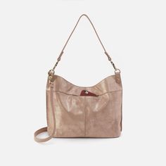 This bag pairs style and function effortlessly, converting from a shoulder bag to crossbody for two looks in one. Elegant Crossbody Hobo Bag For Everyday Use, Elegant Hobo Satchel With Adjustable Strap, Adjustable Strap Hobo Bag For Errands, Versatile Hobo Shoulder Bag With Adjustable Strap, Everyday Crossbody Hobo Bag With Removable Pouch, Chic Crossbody Hobo Bag For Everyday Use, Elegant Hobo Shoulder Bag With Removable Pouch, Elegant Everyday Hobo Bucket Bag, Taupe Leather Shoulder Bag With Detachable Strap