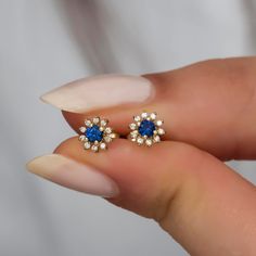 Yellow gold, white diamond and blue sapphire Material: Solid Gold (not gold plated or gold filled) Available Gold Color: Yellow gold, rose gold and white gold Karat: 14 K (585) Diamond weight: 0.05 ct Blue sapphire: 0.05 ct 1 piece of earrings for gold grams: 0.60 gr Diamond color: F-G Color Made to order I design my products with modernity and elegance suitable for daily use and special occasions. ★ ★ ★ I ship my products in a gift box. A tool and gift to make your loved ones and yourself happy Fine Jewelry Gold Ring With Lab-created Sapphire, Gold Jewelry With Lab-created Sapphire For Anniversary, 14k Gold Cluster Earrings With Diamond Accents As Gift, Gold Jewelry With Round-cut Lab-created Sapphire, Gold Jewelry With Round Cut Lab-created Sapphire, Gold Jewelry With Lab-created Sapphire Birthstone, Gold Round Cut Lab-created Sapphire Jewelry, Gold Birthstone Jewelry With Lab-created Sapphire, Yellow Gold Lab-created Sapphire Jewelry Gift