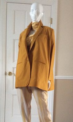 The jacket has a lot of body. The hem is structured with a stiff inner lining so that the jacket stands away from the body. This iconic shape of Romeo Gigli’s is a signature style. The lapel is notched and falls to the waistline. There is a boutonniere button hole in the lapel. The jacket has a working breast pocket, two front pickets, and two working interior menswear style pockets. Unlined, except for the sleeves. Oversized Solid Blazer With Notch Lapel, Oversized Classic Long Blazer, Oversized Single Button Long Sleeve Blazer, Oversized Blazer With Hidden Button Closure And Suit Collar, Oversized Blazer With Lapel Collar, Oversized Blazer With Single Button And Suit Collar, Oversized Single-breasted Blazer With Suit Collar, Oversized Single Button Blazer With Suit Collar, Oversized Single Button Chic Blazer