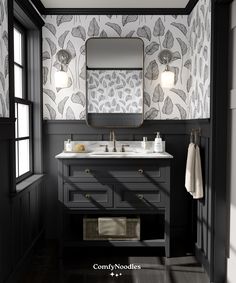 a bathroom with black and white wallpaper, two sinks and a large mirror above it