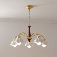 a chandelier with five lights hanging from the ceiling