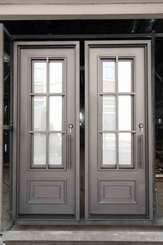 two double doors with glass on each side