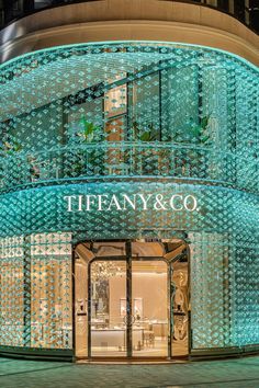 the entrance to tiffany & co store at night