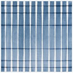 a blue and white rug with stripes on it