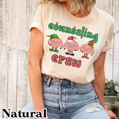 "Counseling Crew Christmas shirt, Holiday Counselor shirt, School counselor shirt, School psych shirt, School therapist tshirt, holiday gifts Size of text and image will vary depending on the size of the shirt. If you would like something different or would like specific information, please feel free to message me! Sizing: Unisex. All measurements are taken while the shirts are lying flat. Width is measured across the chest (under arm to underarm). Length is measured from shoulder to the bottom of the shirt. We recommend sizing up fora roomier fit (t-shirts are  generally true to size. Made with Bella canvas t-shirts.  Bella Canvas T-shirts Approximately: (Size up for a roomier fit- T-shirts typically fit true to size) Small: 18\" W x 28\"L Medium: 20\" W x 29\" Large: 22\"W x 30\" L XL: 2 Peppermint Coffee, Vintage Christmas Shirt, Snowman Shirt, Elf Shirt, Xmas Tees, Squad Shirt, Group Shirts, Holiday Shirt, Gildan Sweatshirts