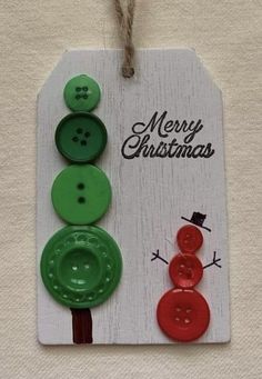 three buttons are attached to a christmas card