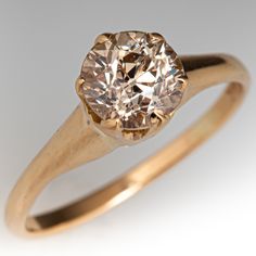 an old - fashioned diamond ring is shown against a white background