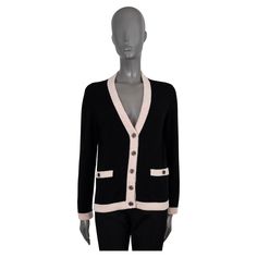 100% authentic Chanel cardigan in black cashmere (100%). Features a V-neck, with contrasting pink speckled cream rib-knit trims and two buttoned pockets at the waist. Closes with rhinestone encrusted metal logo buttons. Unlined. Has been worn and is in excellent condition. 2020 Spring/Summer Measurements Model 20S P64359 K60197 N7070 Tag Size 38 Size S Shoulder Width 41cm (16in) Bust From 94cm (36.7in) Waist From 92cm (35.9in) Hips From 92cm (35.9in) Length 59cm (23in) Side Seam Length 37cm (14.4in) Sleeve Length 60cm (23.4in) All our listings include only the listed item unless otherwise specified in the description above Designer V-neck Cardigan With Button Closure, Luxury V-neck Outerwear With Button Closure, Luxury Black Sweater With Button Closure, Luxury Black Wool Cardigan, Designer Black Wool Cardigan, Designer V-neck Cardigan For Work, Luxury Black Cardigan With Buttons, Luxury Black Cardigan With Button Closure, Designer Black Cardigan With Button Closure