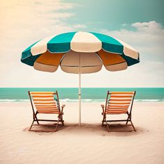 two chairs under an umbrella on the beach