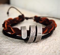 a couple of bracelets sitting on top of a table