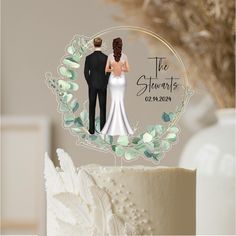 a wedding cake topper with an image of a bride and groom in the middle