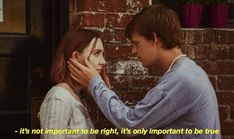 two people standing next to each other near a brick wall with the words, it's not important to rights only important to true love