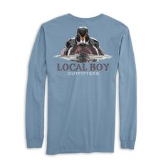 Get ready to show off your love for your hometown with the Local Boy Woodrow Long Sleeve! Made with high-quality material, this long sleeve shirt features the classic and iconic Local Boy logo. Perfect for any occasion, this shirt will keep you comfortable and stylish while representing your local pride. Long Sleeve Screen Print Fan Apparel Top, Relaxed Fit Long Sleeve Fan Apparel Top, Casual Long Sleeve Shirt With Screen Print, Fall Fan Apparel Long Sleeve Tops, Cotton Long Sleeve Fan Apparel Tops, Casual Long Sleeve Pre-shrunk Shirt, Relaxed Fit Long Sleeve Fan Apparel T-shirt, Fan Apparel Long Sleeve Relaxed Fit T-shirt, Vintage Long-sleeve Graphic Print T-shirt