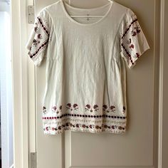 True To Medium, But Also A Small. Very Stretchy White Crew Neck Top With Floral Embroidery, White Floral Embroidered Relaxed Fit Top, White Floral Embroidery Relaxed Fit Top, White Short Sleeve Top With Embroidered Hem, White Floral Embroidered Relaxed Top, Casual White Top With Floral Embroidery, White Embroidered Short Sleeve Top With Relaxed Fit, White Embroidered Hem Top With Short Sleeves, White Embroidered Top With Short Sleeve