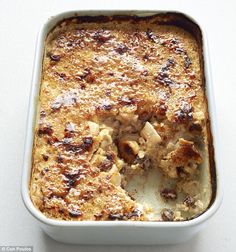 a casserole dish with meat and cheese in it on a white counter top