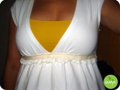 a woman wearing a white and yellow dress