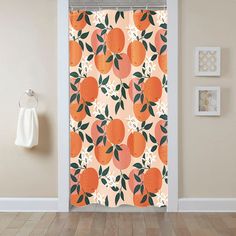 an orange and white shower curtain in a bathroom