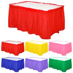 various colors of plastic table cloths with different designs on the top and below them