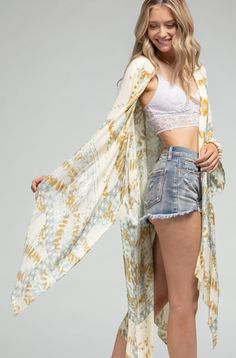 Stunning tie-dye with geometric motif kimono with side slits *100% Viscose *APPROX. L 37" W 41.50" Available Online & In-Store From the #1 Boutique in Oceanside Summer Kimono With Abstract Print And Kimono Sleeves, Spring Beach Cover-up Duster, Tie Dye Kimono For Festivals, Spring Tie Dye Kimono With Kimono Sleeves, Festival Tie-dye Kimono With Kimono Sleeves, Tie-dye Kimono With Kimono Sleeves For Festivals, Festival Tie-dye Kimono, Bohemian Batik Print Kimono For Summer, Spring Beach Cover-up Duster Open Front