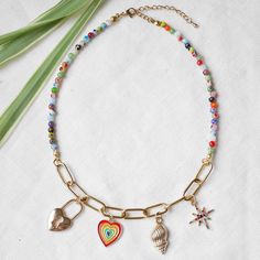 Millefiori custom charm necklace is so colorful and cute. Truly a unique one - because you will design it yourself! Gold-plated stainless steel, with small (4 mm) colorful millefiori glass beads, this necklace comes with your choice of 4 charms.  The length of the necklace is 15 inches, with 2 in extension so you can adjust the length between 15 - 17 inches (38-43 cm). Let me know if you want another length! Here's how it works: 1. Take a look at my charm options and choose 4 charms that you like.  2. Write in the "Add your personalisation" field the numbers of the charms you want in your necklace (for example 2F, 16, 40, 64). Please also let me know if you want the charms in a specific order, or if I can choose the order of the charms for you. Looking for matching earrings? You can find t Custom Charm Necklaces, Handmade Pendant Necklace, Custom Charms, Handmade Pendant, Beaded Choker, Handmade Pendants, Matching Earrings, Jewelry Care, Personalized Jewelry