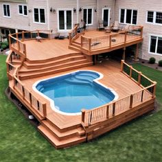 an above ground pool surrounded by wooden decks