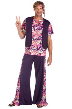 a man in a hippie outfit is making the peace sign