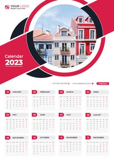 a red and white calendar with houses in the background