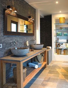 a bathroom with two sinks and a large mirror