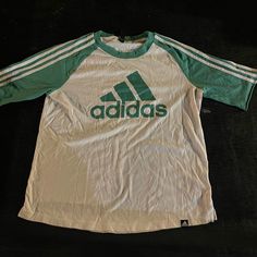 Adidas Green T-Shirt With Green Stripes On Sleeves Size Large Never Worn Casual Summer T-shirt With Three Stripes, Adidas Three Stripes T-shirt For Spring, Adidas T-shirt For Spring Streetwear, Green Adidas Tops With Logo, Casual T-shirt With Three Stripes Branding For Spring, Casual Green Adidas Logo T-shirt, Summer Crew Neck T-shirt With Three Stripes, White Adidas Logo Crew Neck T-shirt, White Adidas Crew Neck T-shirt