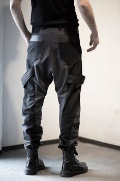 Dark gray & black pants designed with fake leather stripes, pockets front and back. Normal wash. Collection 'DISTRESSOR' Spring '21 Urban Fitted Parachute Pants With Belt Loops, Fitted Urban Parachute Pants With Belt Loops, Black Cyberpunk Pants For Cosplay, Urban Fitted Parachute Pants, Avant-garde Black Pants For Streetwear, Alternative Style Pants With Multiple Pockets, Fitted Cyberpunk Bottoms With Pockets, Futuristic Fitted Bottoms For Streetwear, Apocalyptic Clothing