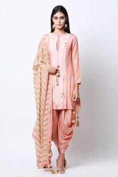 Pink straight kurta with placement floral motif print and embroidery. Comes with leheriya dupatta and dhoti pants.
Components: 3
Neckline: Round
Sleeve Length: Full
Color: Pink
Printed,Embroidered
Straight kurta with side slits
Front keyhole neck with tassel tie up
Kurta with side panel detail
Dupatta with chevron printed border
Dhoti style pants - Aza Fashions Dhoti Style Kurti, Kurti Dupatta, Style Kurti, Dhoti Pants, Pink Round, Bridal Lehenga, Beautiful Saree, Pant Set, Ethnic Wear