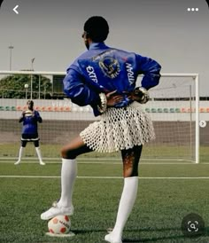 a person standing on top of a soccer field