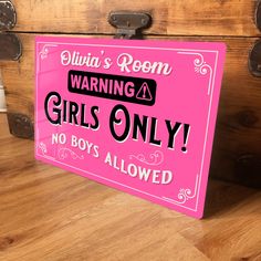 there is a pink sign that says warning girls only no boys allowed on the chest