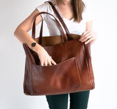 OVERSIZED LEATHER TOTE BAG - LEATHER SHOPPING BAG - LARGE TOTE This Leather Handbag is made of full grain, high quality natural leather. It's is very roomy - perfect for school, work and travel - great option as your everyday bag. Large interior provides a lot of space for all the daily essentials (books, cosmetic bag, accessories, laptop and other electronic devides, clothes and more). Inside the shopper bag there is an additional pocket with zipper for other small items. There is also large po Classic Brown Bags With Flat Pocket, Leather Tote Shoulder Bag With Flat Pocket, Brown Hobo Bag With Pockets For Shopping, Brown Shopping Bag With Pockets, Leather Tote Bag With Flat Pocket, Leather Shoulder Bag With Flat Pocket, Brown Satchel With Pockets For Shopping, Brown Shoulder Bag With Flat Pocket, Brown Bag With Flat Pocket For Everyday Use