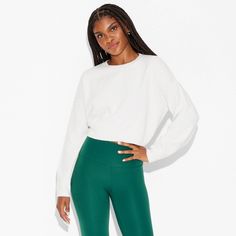 Standard-fit pullover sweater in a solid color from Wild Fable™. Designed with a cropped silhouette. Made from recycled polyester-nylon blend jersey fabric with added spandex. Features a crewneck style with ribbed sleeves. If you're not satisfied with any Target Owned Brand item, return it within one year with a receipt for an exchange or a refund. Wild Fable™: A look for every story. High Stretch White Crop Top For Fall, Athleisure Long Sleeve Cropped Sweater For Fall, White Cropped Relaxed Fit Sweatshirt, White Winter Top With Ribbed Waistband, Versatile Stretch Cropped Sweater For Fall, White Stretch Sporty Sweater, White Stretch Crop Top For Fall, Sporty Cropped Sweater With Ribbed Waistband, Sporty Stretch Sweatshirt