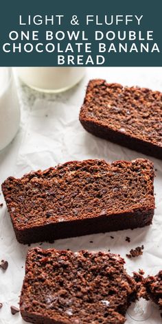 three pieces of chocolate banana bread sitting on top of a white paper towel next to a glass of milk