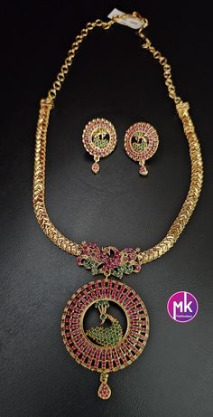 Peacock Premium gold finish AD Ruby stone necklace with matching Big Earrings - Traditional Jewelry - Mk Fashionkart Earrings: Matching Earrings Material: premium polish, Matte gold finish, AD stones Suitable for Saree/Salwar/party wear dresses Adjustable length    SHIPPING : Ready to ship in 1 business day. This item will be shipped from The United States. Jewelry care instructions : 1. Please wipe the jewelry with a piece of cotton cloth after usage.  2. Store the jewelry in a cool, dry and air tight box or pouch.  3. Make sure the jewelry is away from direct heat and water. 4. Please wipe of any moisture, sweat, soap water after usage. Salwar Party Wear, Ruby Stone Necklace, Earrings Matching, Jewelry Care Instructions, Ruby Stone, Big Earrings, Traditional Jewelry, Matte Gold, Stone Necklace