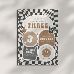 there is a card with some stickers on it that say three and the number three